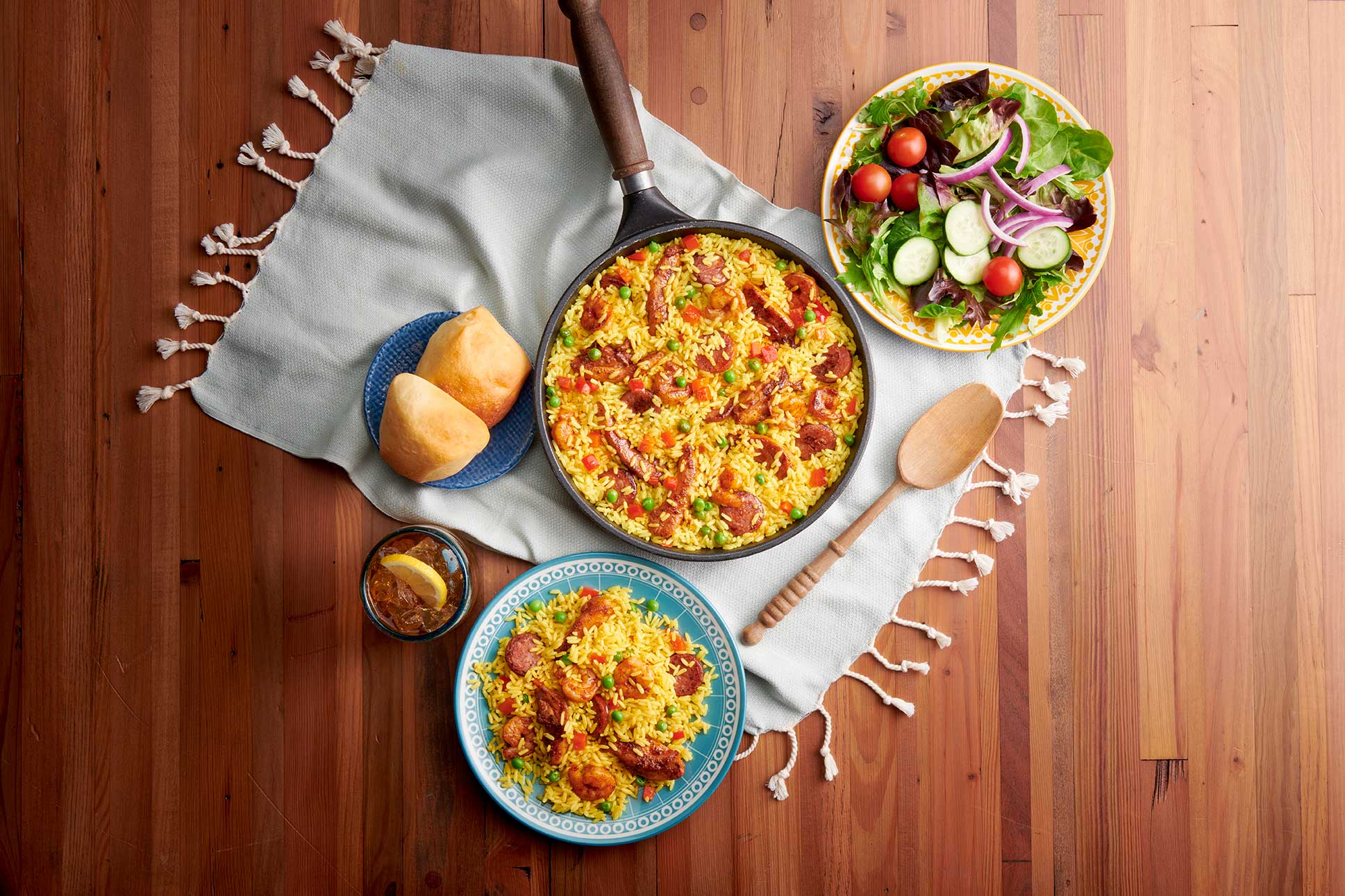 Golden corral buffet items plated, Paella and salad rolls with dinner rolls